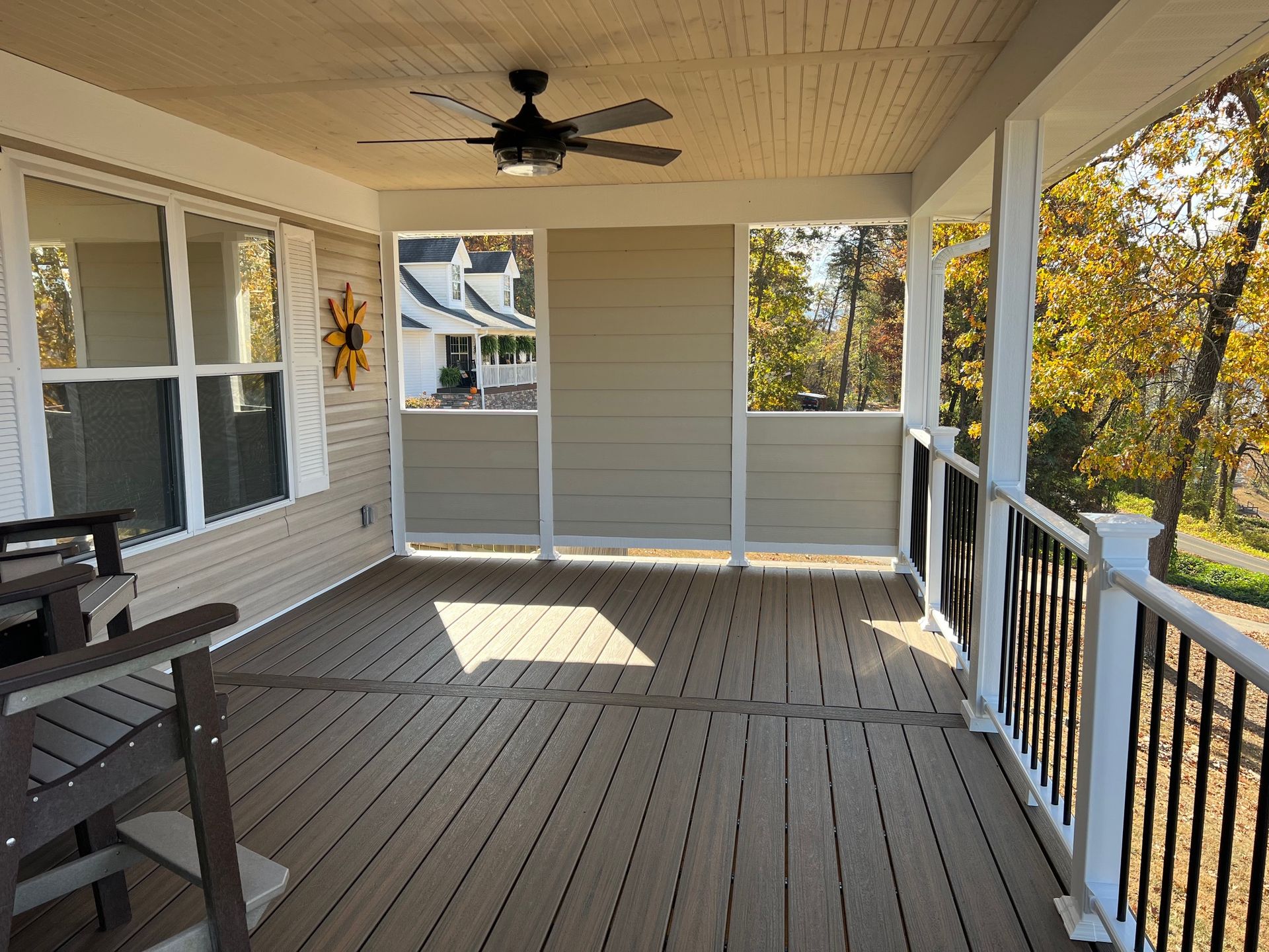 A porch with a ceiling fan