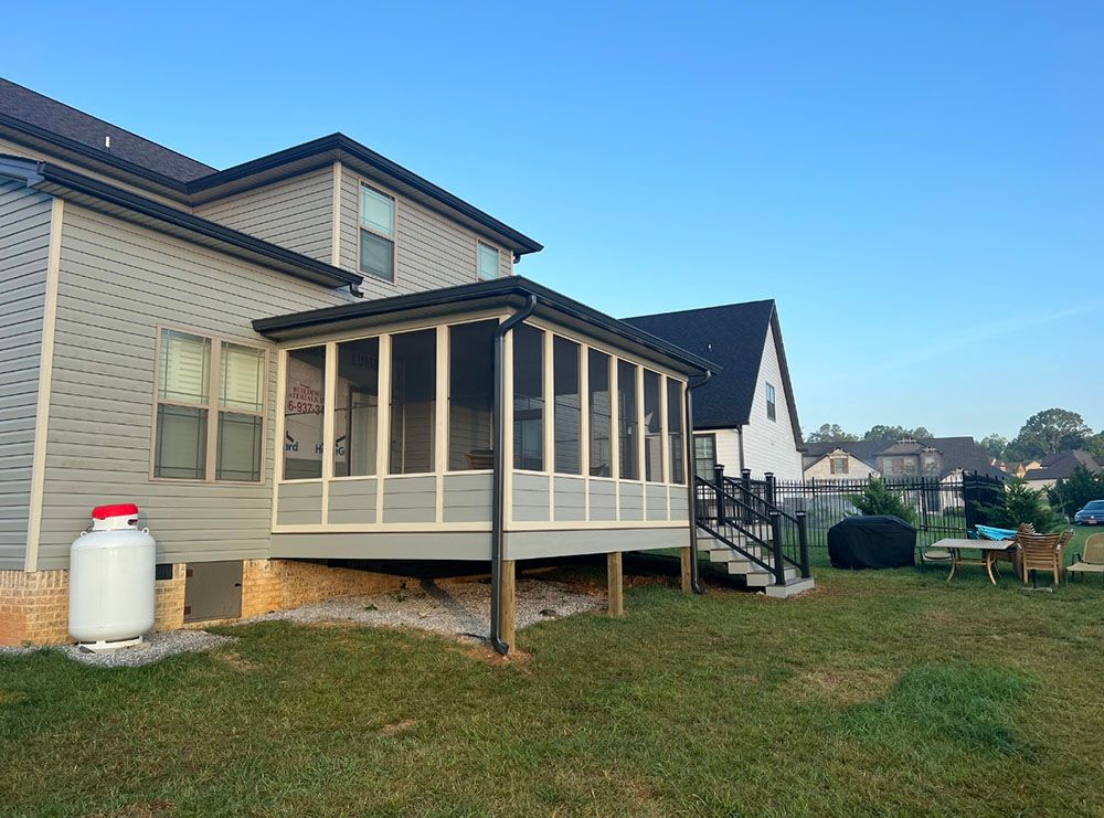 exterior side of deck work and sunroom