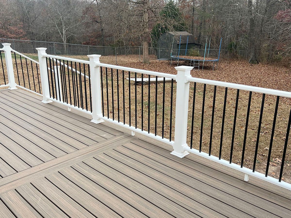 A wooden deck with a beautiful railing