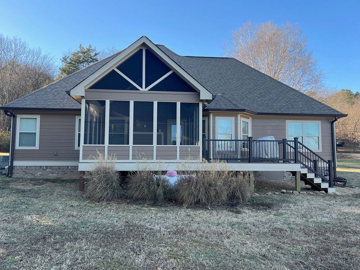 A house with a screened porch and stairs