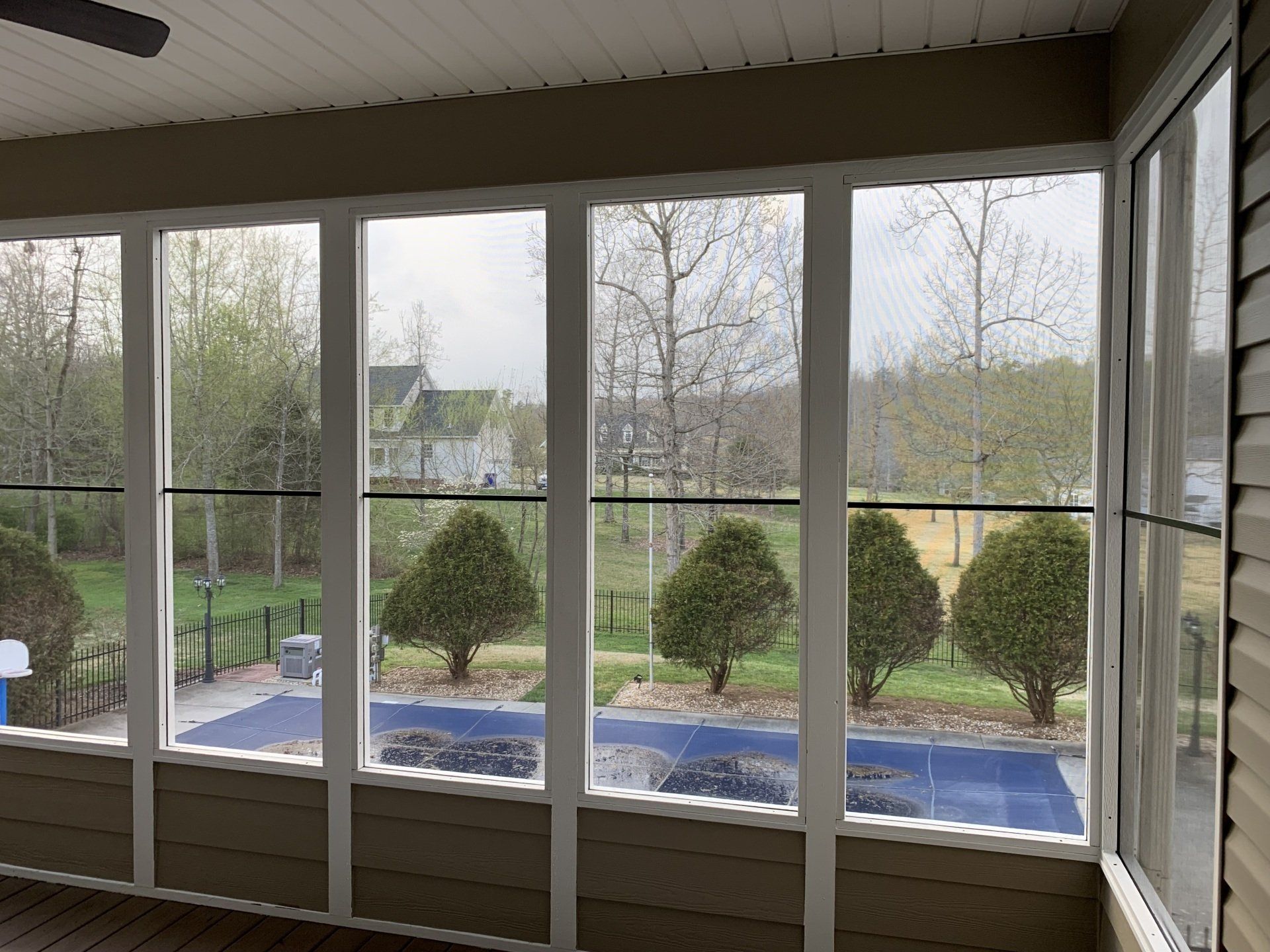 screen room with pool outside