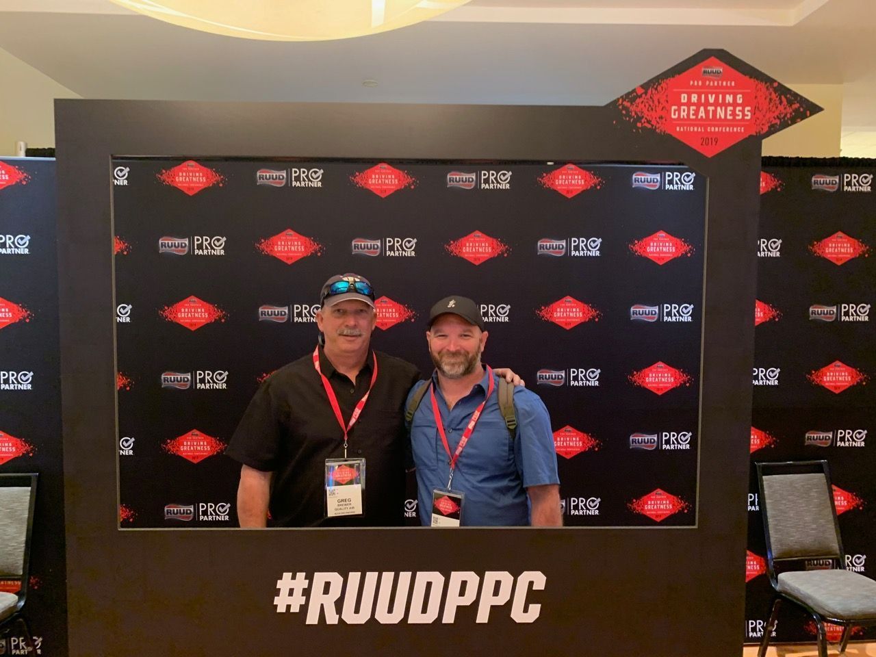Two men taking a photo together at the #RUUDPPC event
