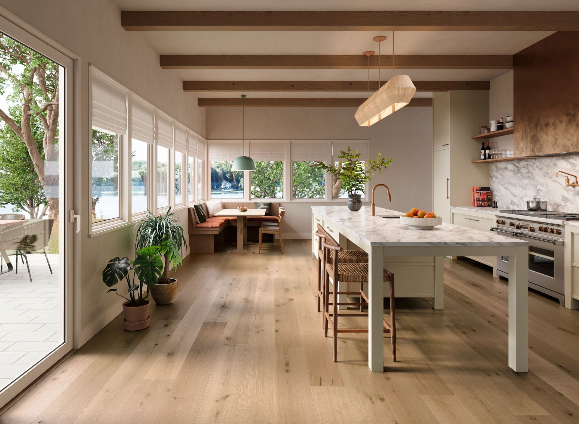Bright modern kitchen with white island, wood floors, large windows, and bar stools
