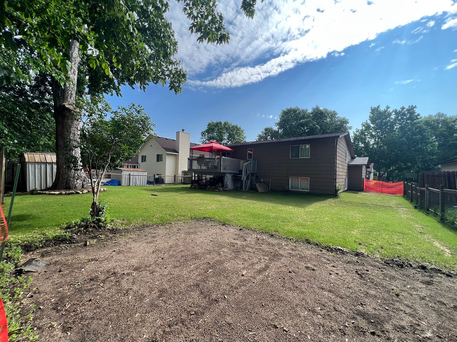 A house is sitting in the middle of a lush green yard