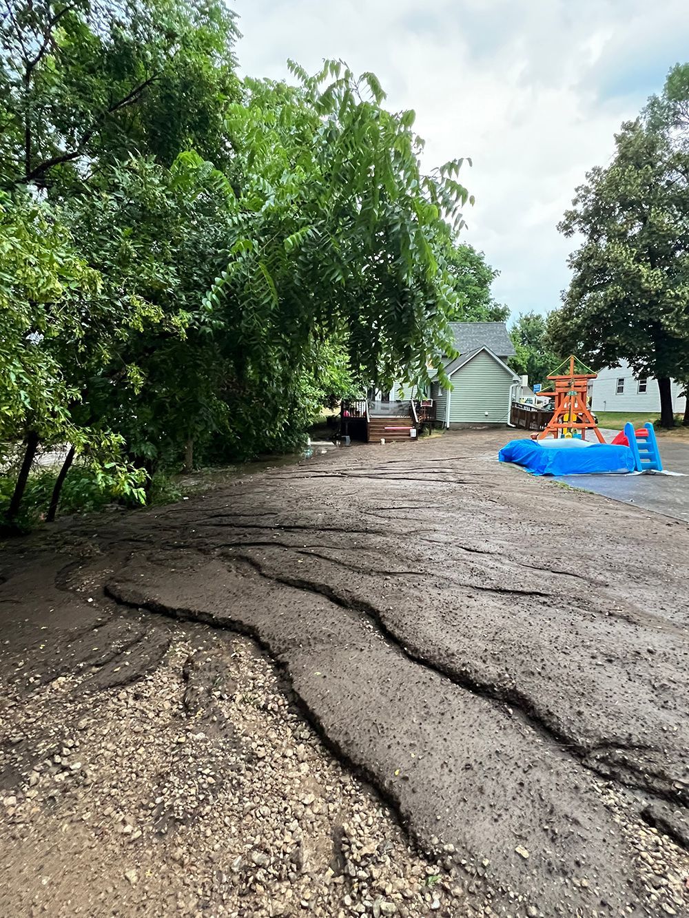 A yard with a house in the background
