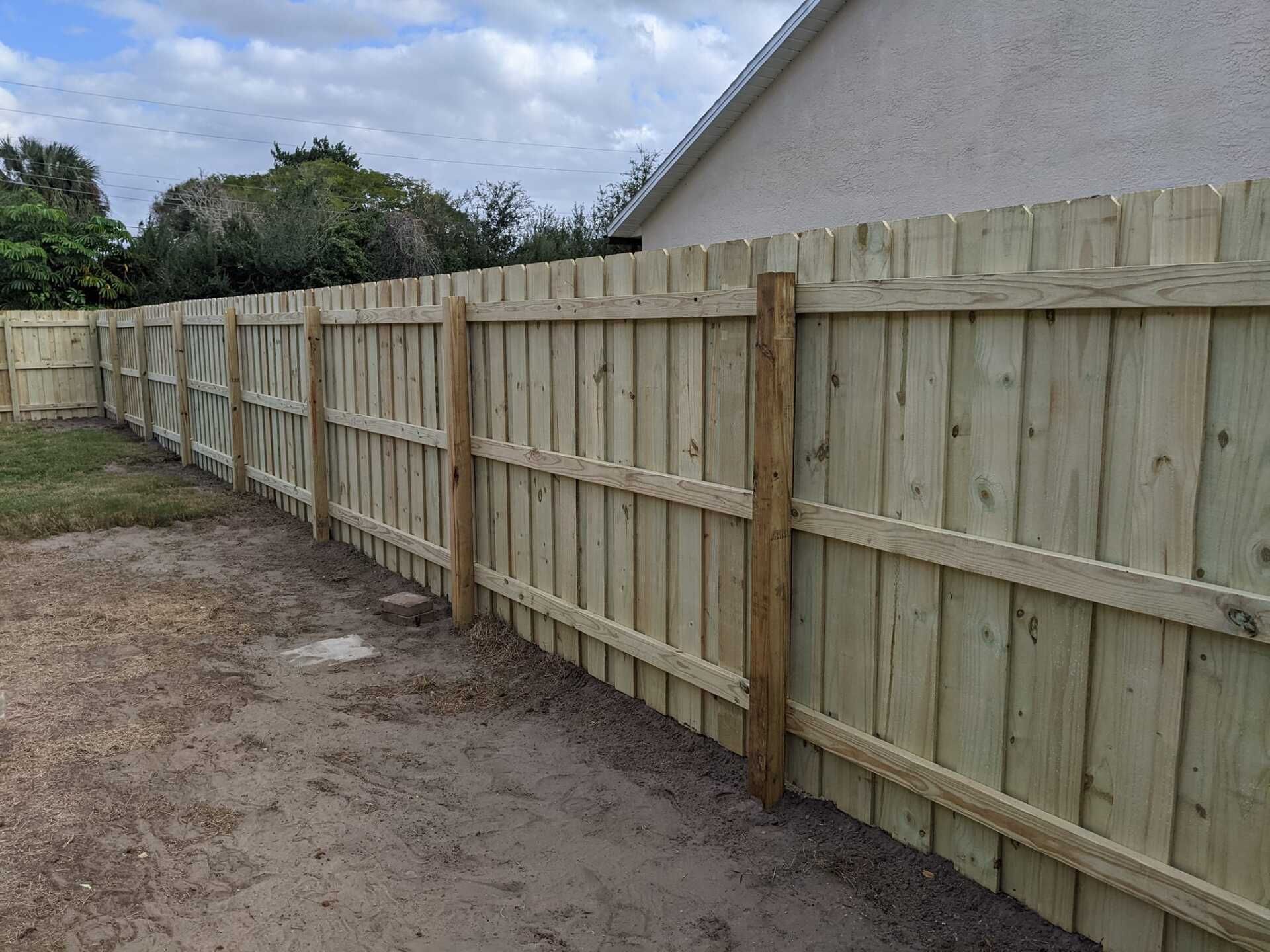 Wooden privacy fence outdoors on a sunny day.