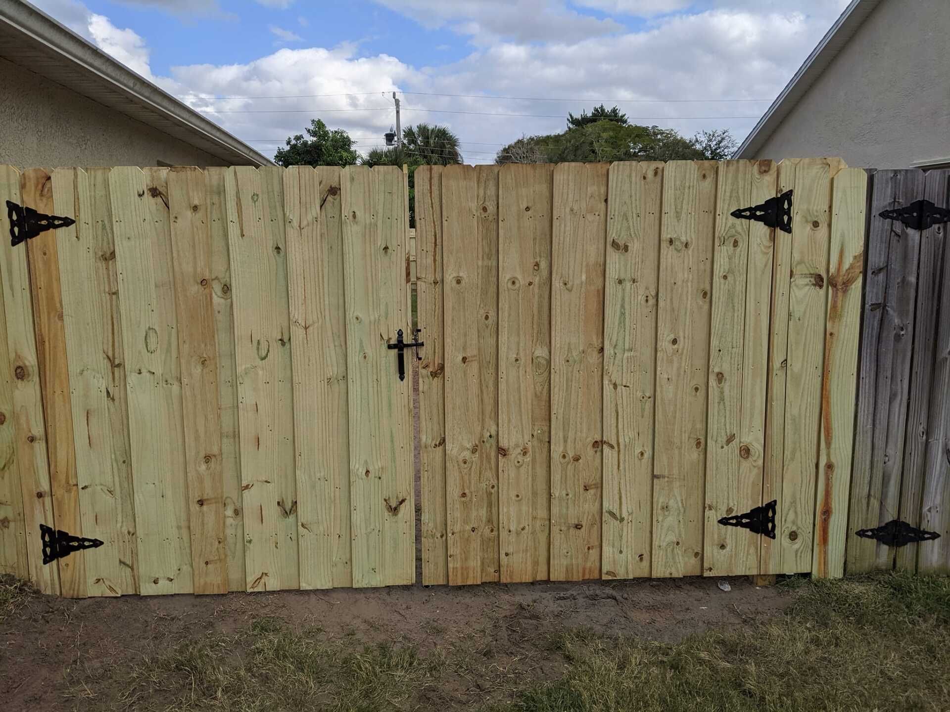 Wooden fence with black hardware.
