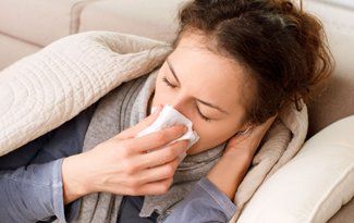 Woman suffering from nasal congestion