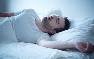 Man snoring due to sleep apnea