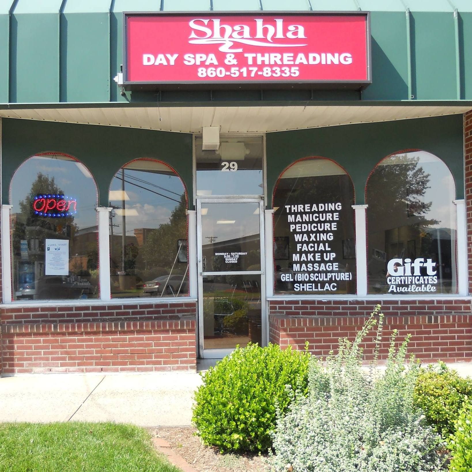 Shahla day spa and threading has a red sign above the door
