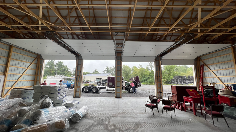 A large warehouse with a lot of machinery inside of it.