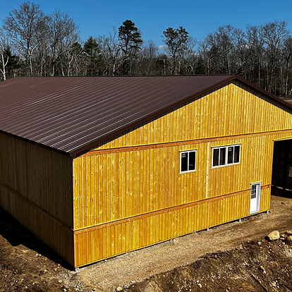 An aerial view of a wooden building with a brown roof