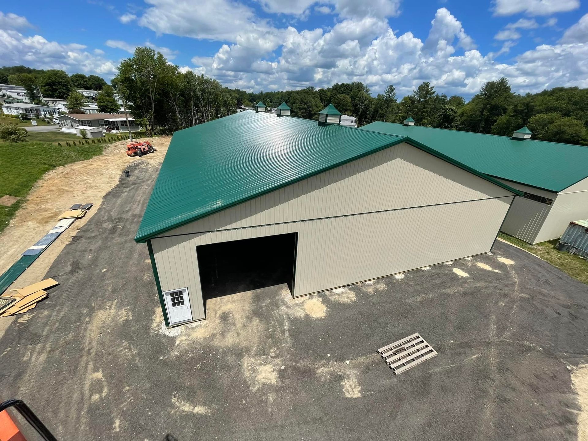 An aerial view of a building with a green roof