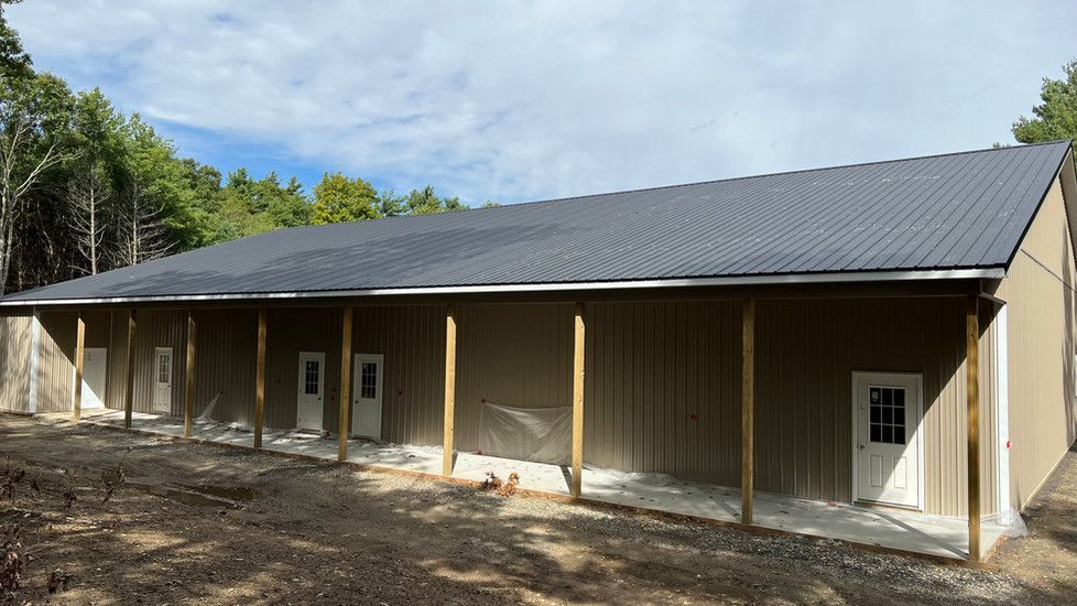 A large building with a porch on the side of it