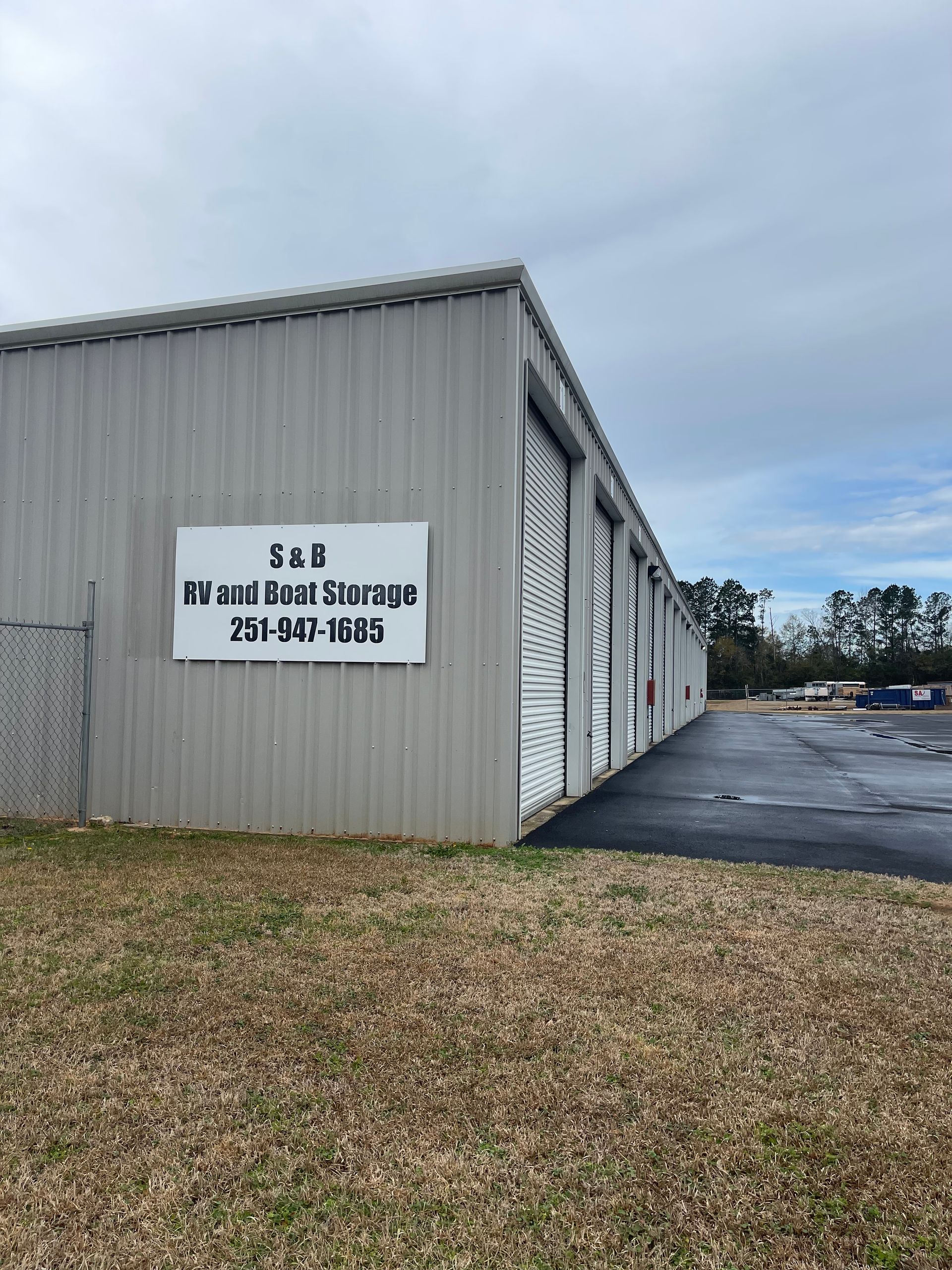 A row of storage units with a sign on the side of the building.