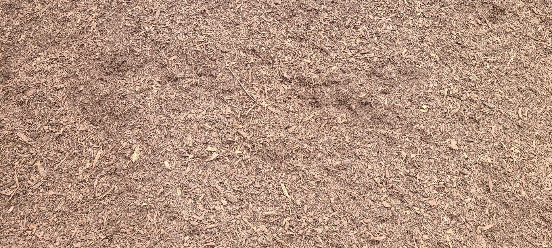 Close-up of a tan, speckled textured surface with a mottled pattern
