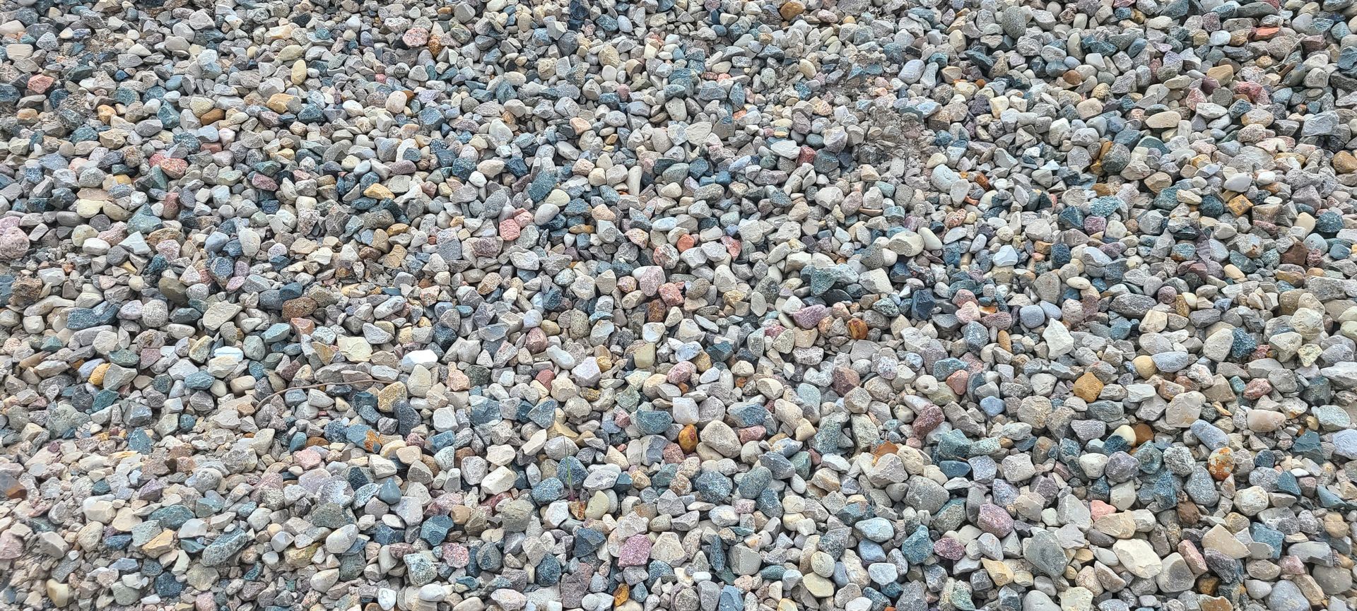 Close-up of multicolored gravel stones covering the ground