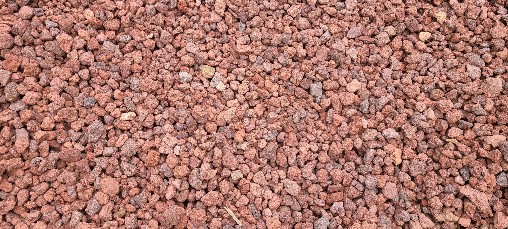 Close-up of a pile of reddish-brown gravel or small rocks