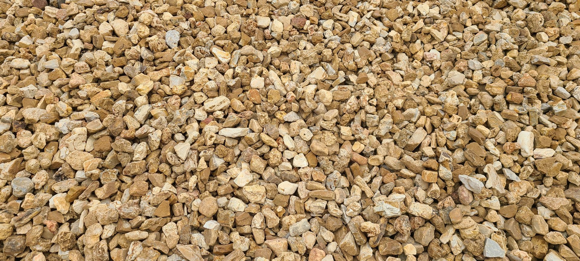 Close-up of tan and brown gravel stones covering the ground
