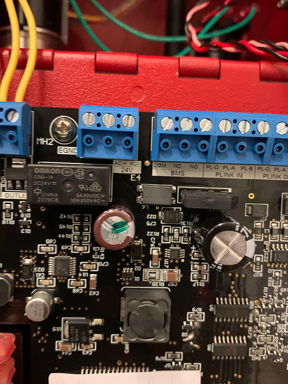 A close-up of an electric panel with blue connectors