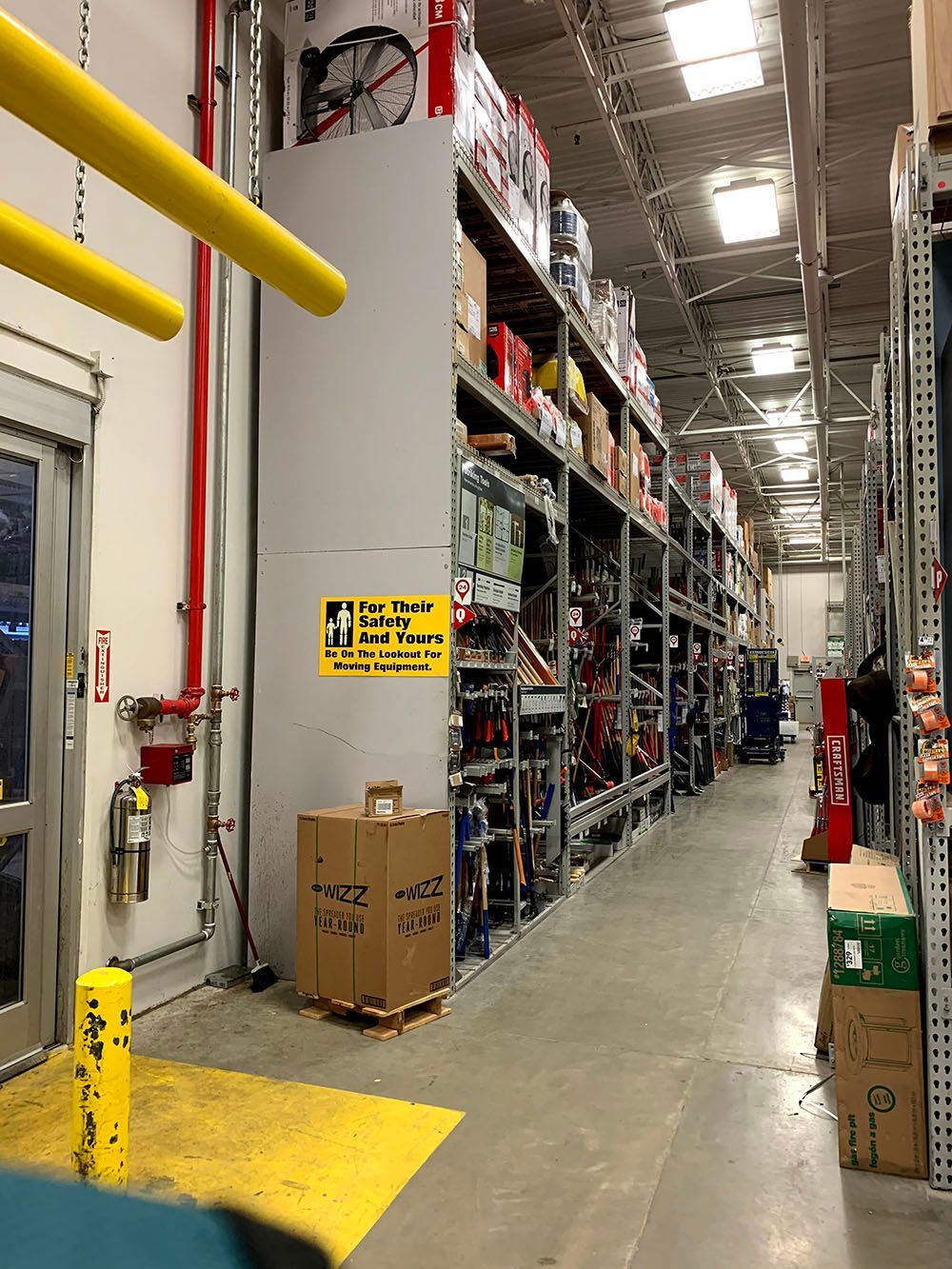 A warehouse with lots of shelves and boxes on them