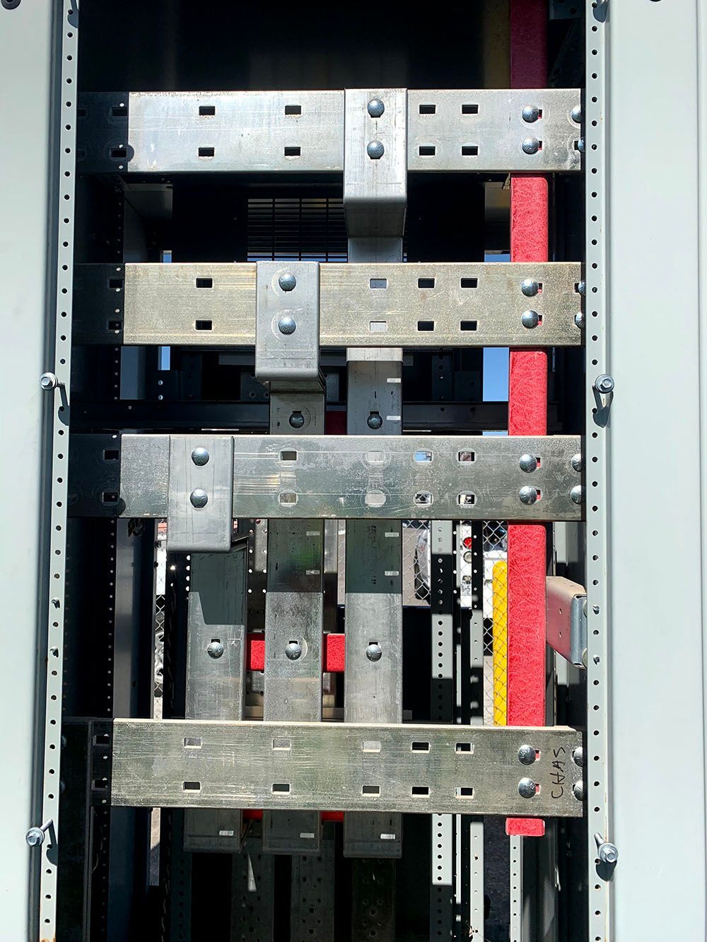 A close up of a electrical box with a bunch of wires coming out of it