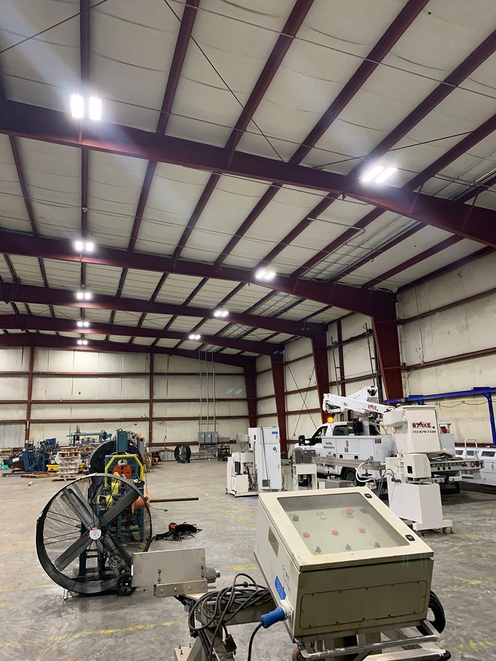 A large warehouse filled with lots of machinery and equipment