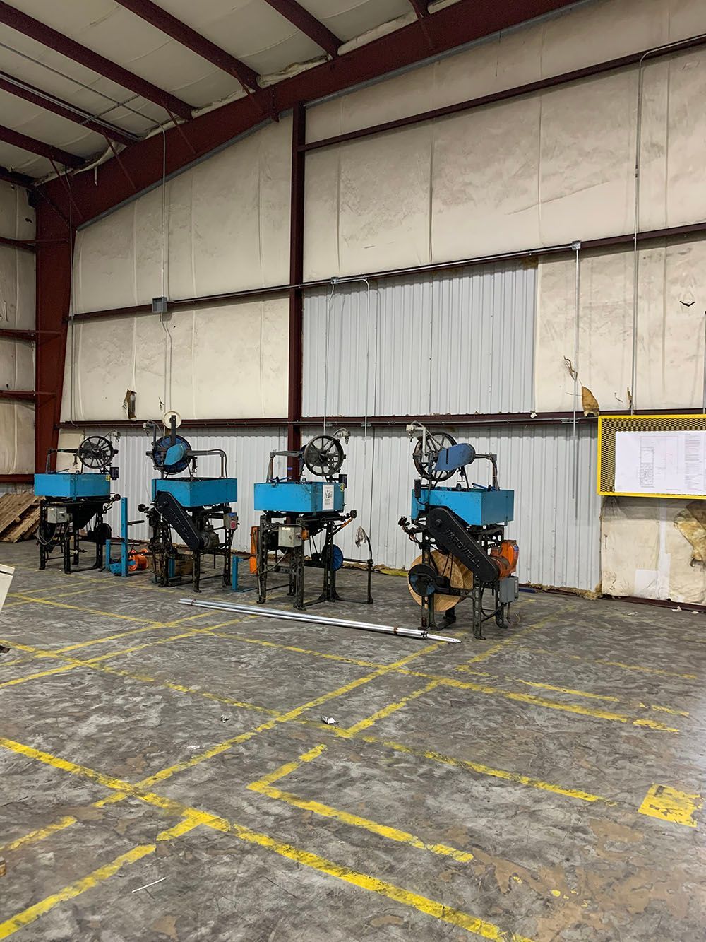 A warehouse with a lot of machinery in it