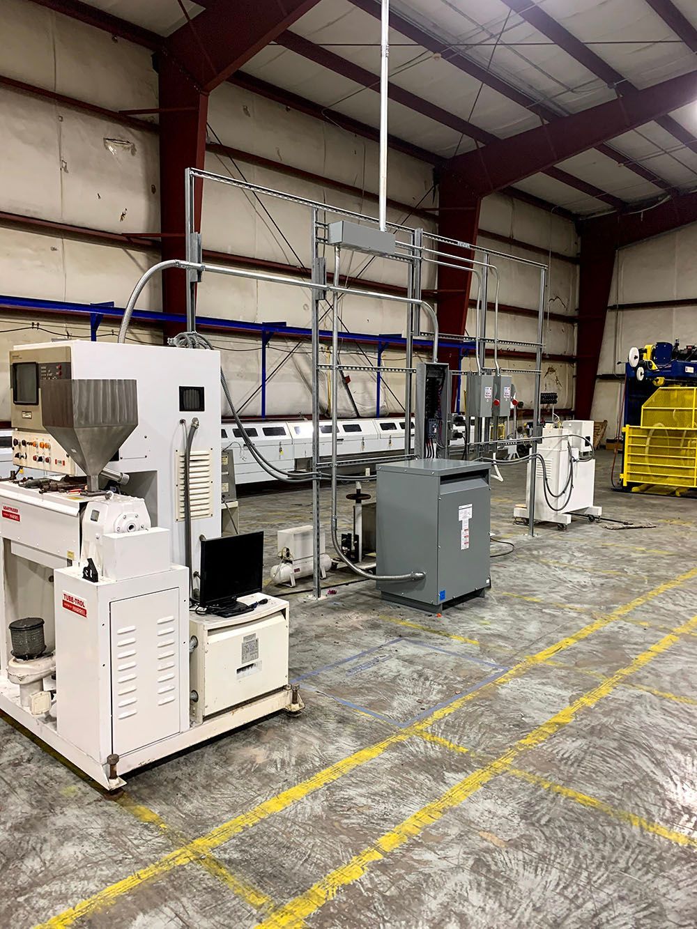 A large warehouse filled with lots of machinery and equipment