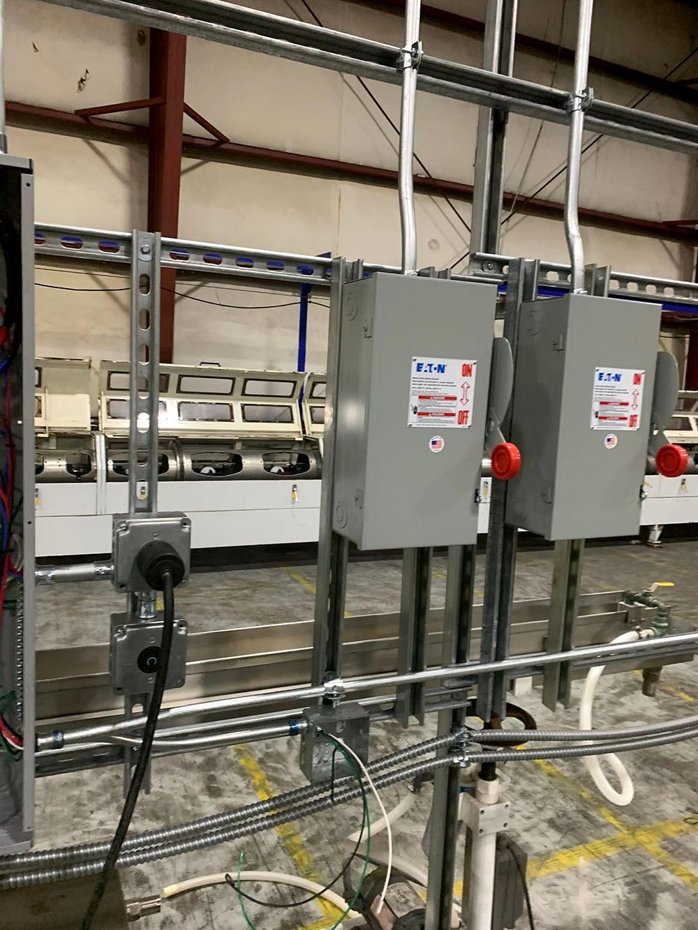 A warehouse with a lot of electrical equipment and boxes