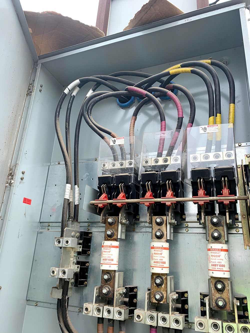 A close-up of an electrical box with a lot of wires properly installed