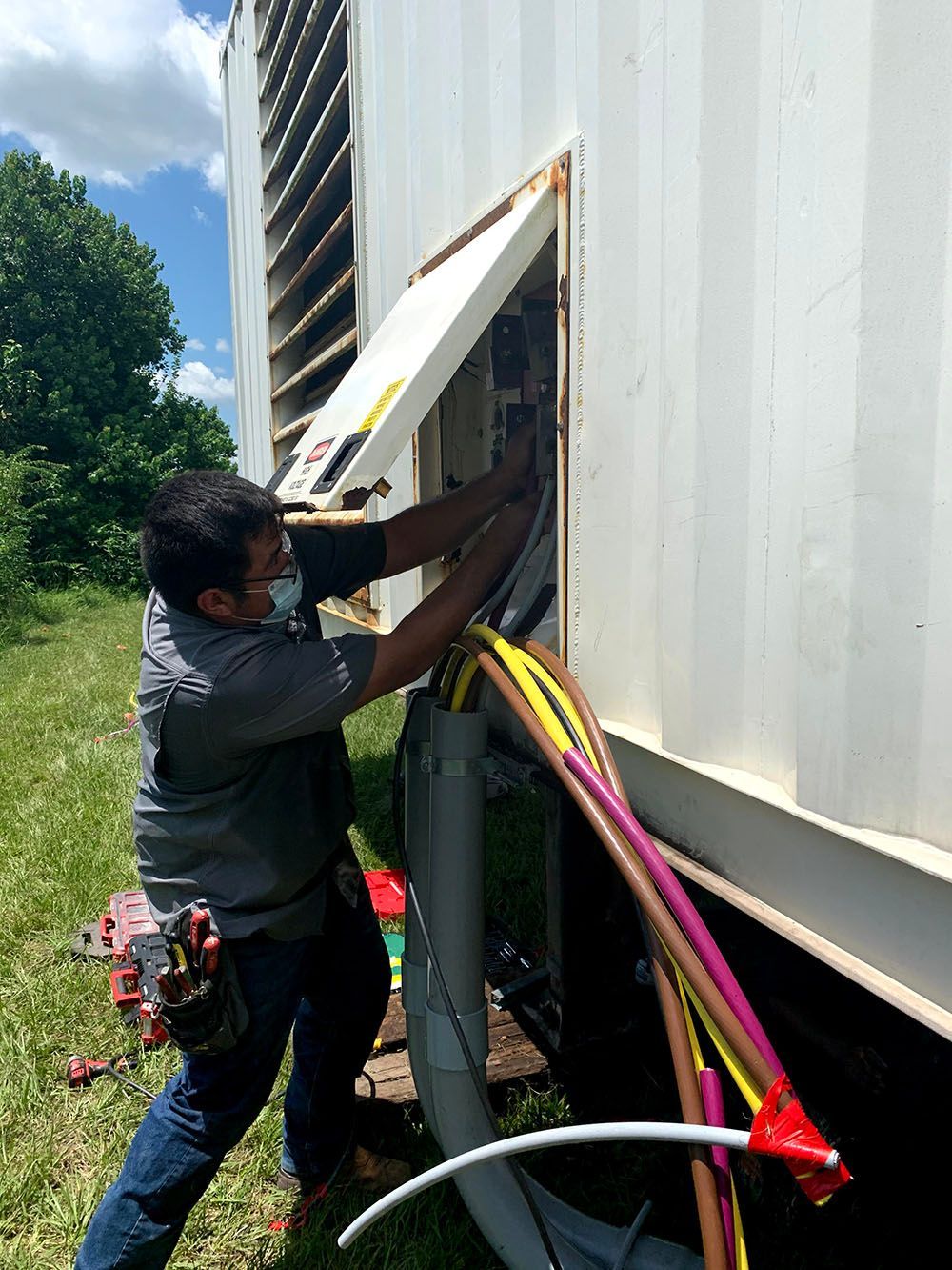 A man is working on a huge power generator