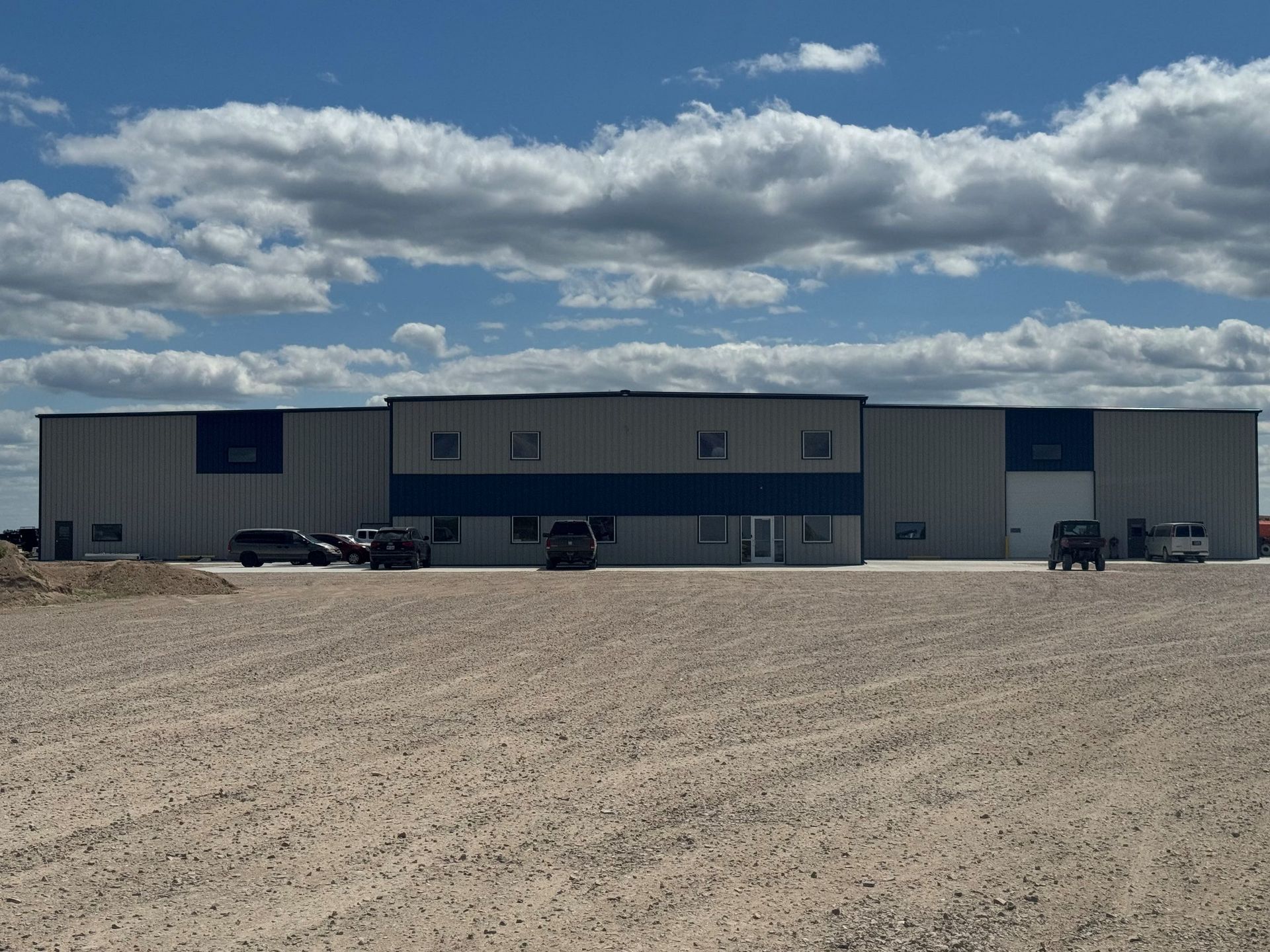 A large building with cars parked in front of it