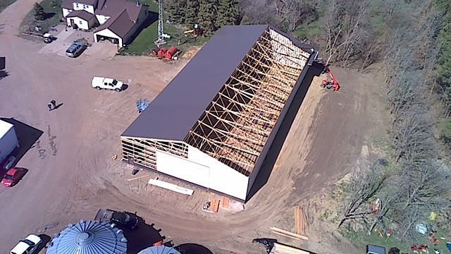 An aerial view of a building under construction in a rural area