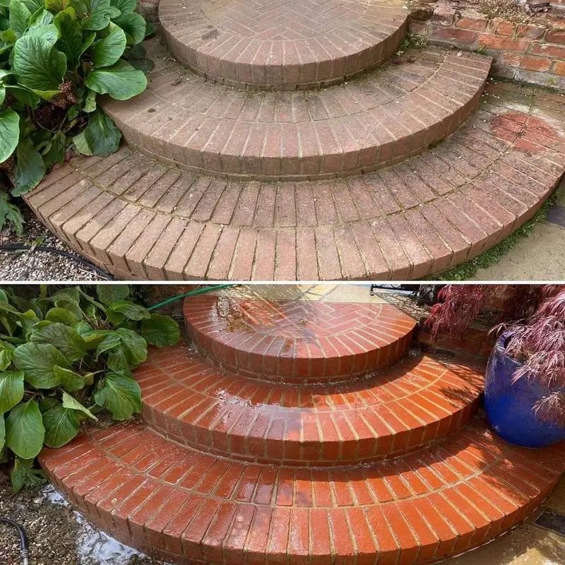 Before-and-after of curved brick steps being cleaned, changing from dull gray to bright red-orange.