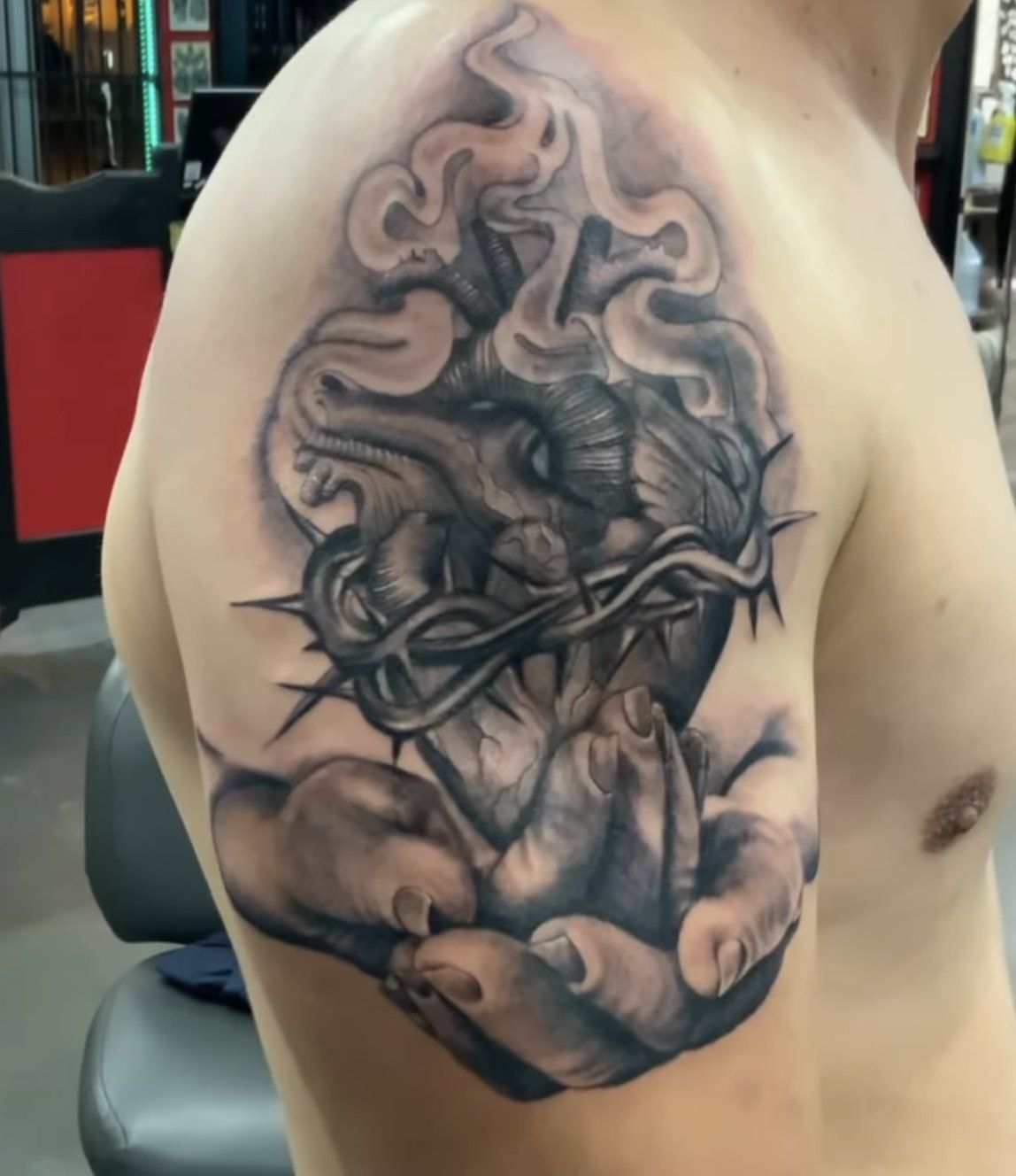 tattoo heart with thorns on hand