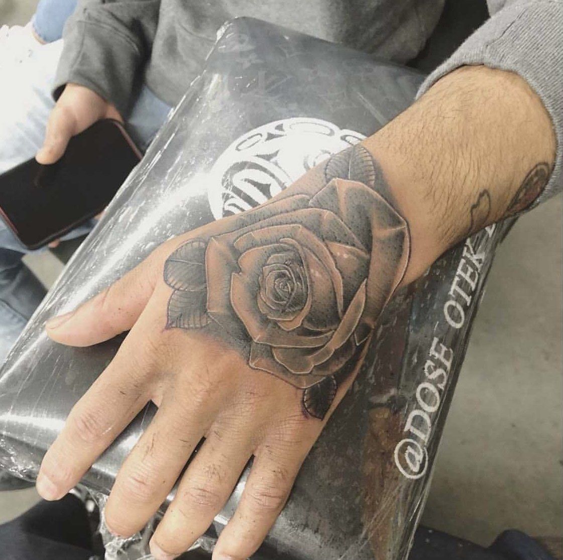 Tattoo rose on hand