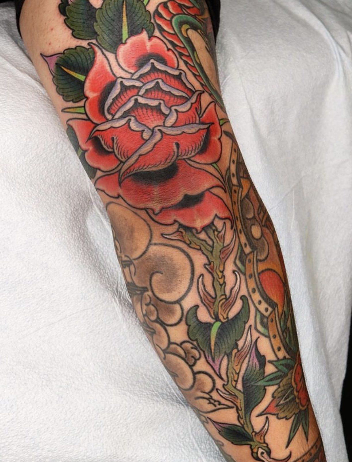 Tattoo arm rose with thorns