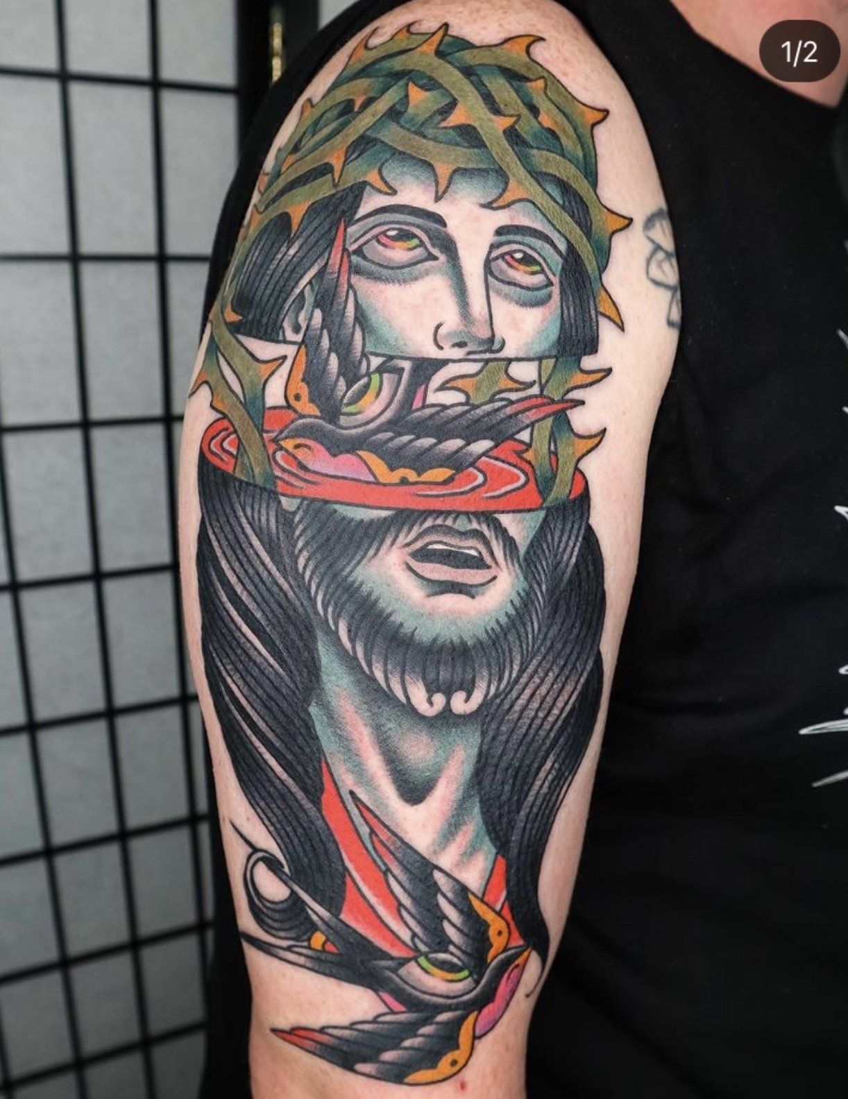 Tattoo arm jesus cut in half