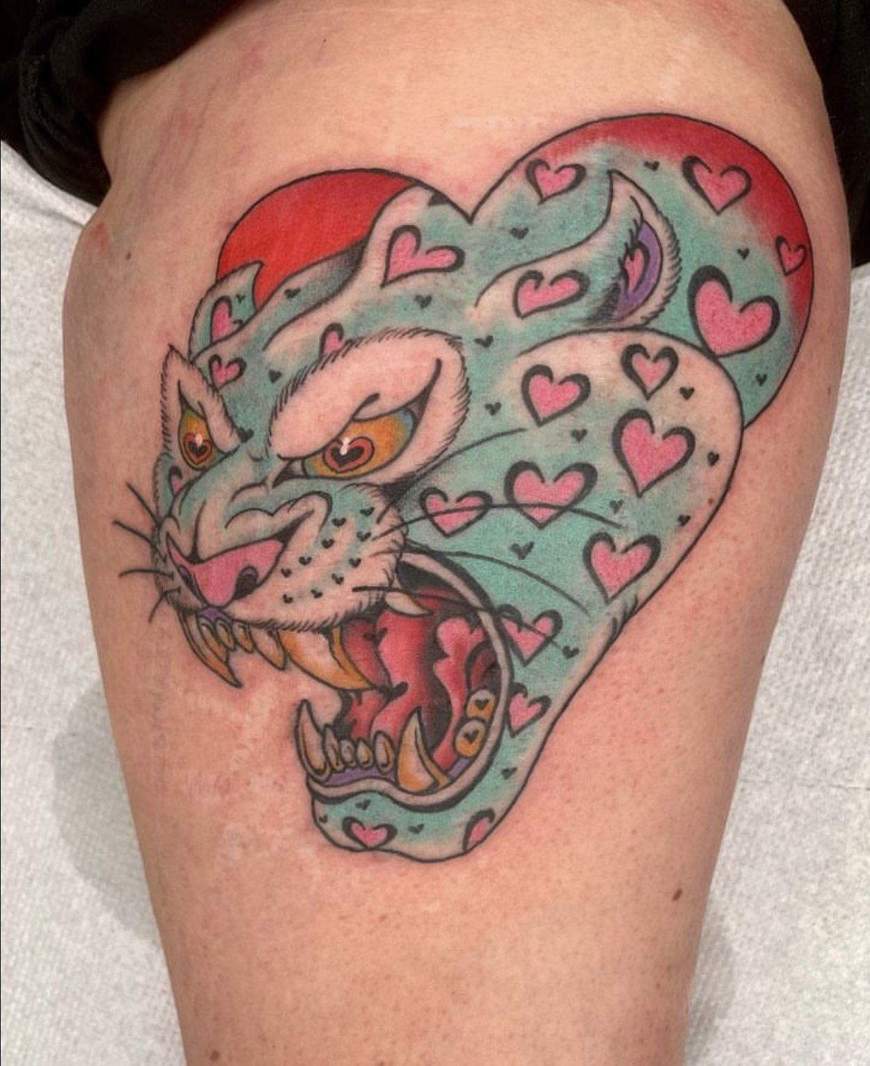 Tattoo tiger or panther on heart