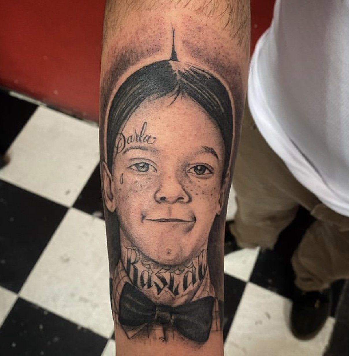 Tattoo alfalfa written darla on forehead