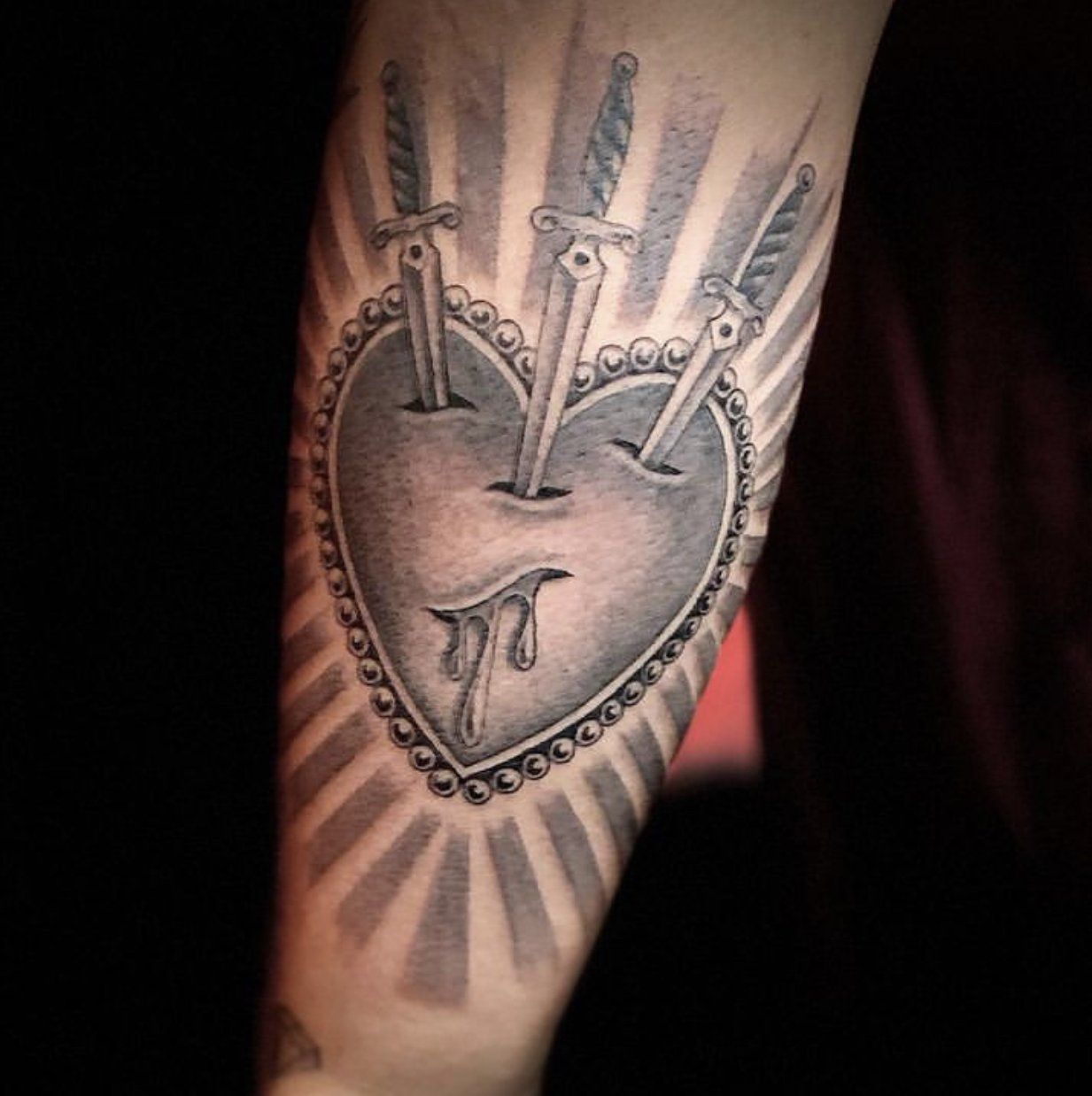 Tattoo heart with three swords