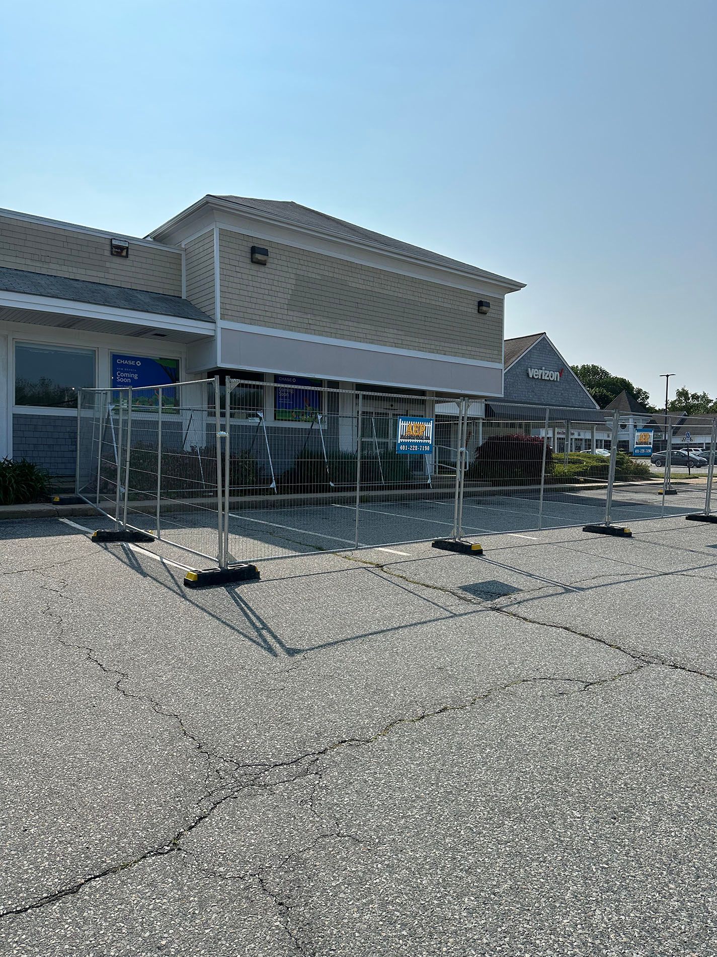 A large building with a lot of parking spaces in front of it.