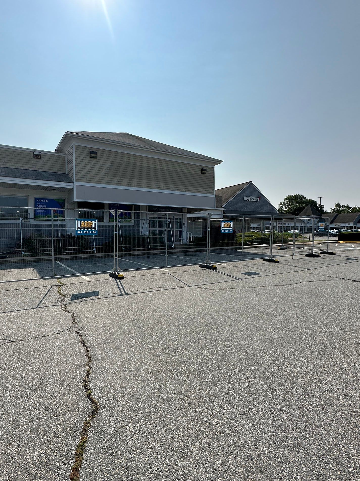 A large building with a lot of gravel in front of it.