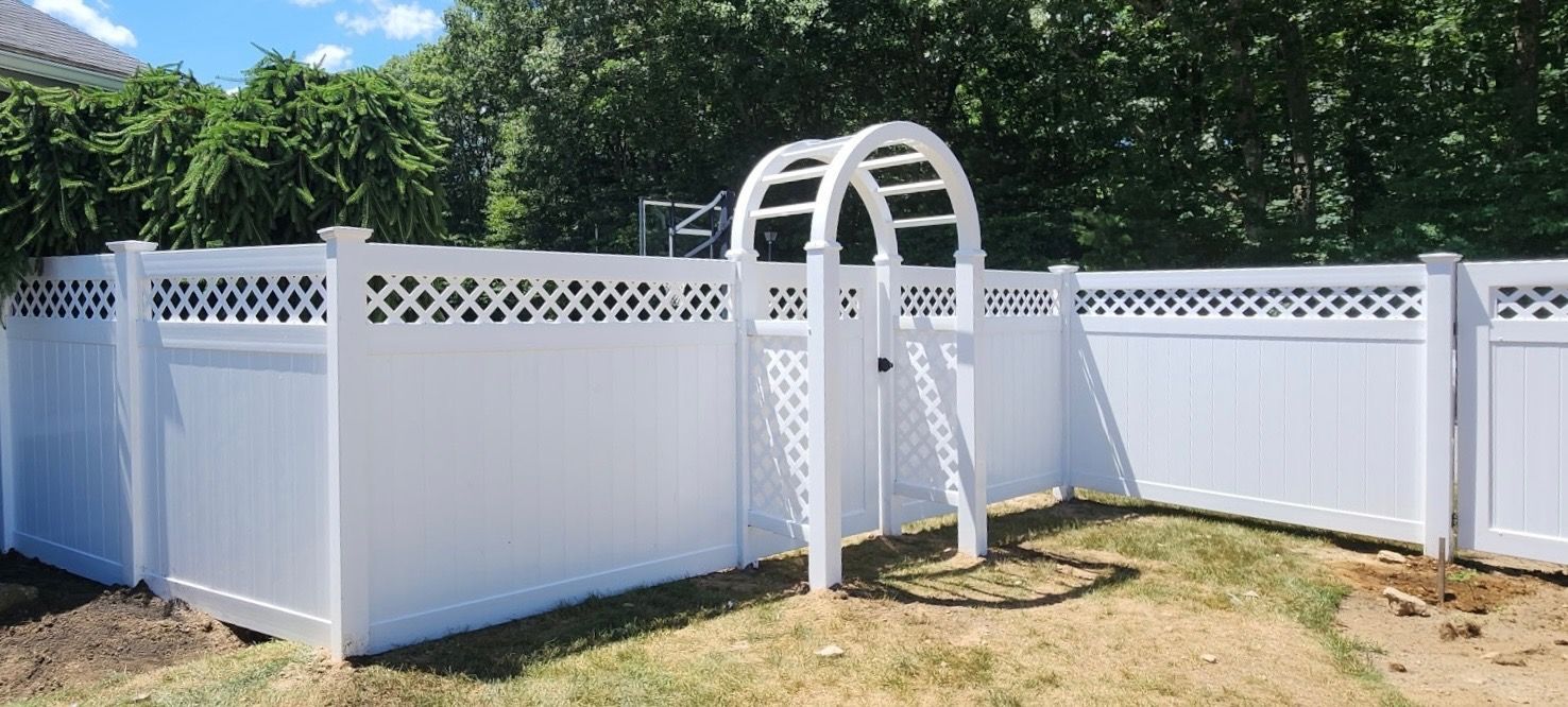 White above-ground pool with ladder in a fenced backyard on a sunny day