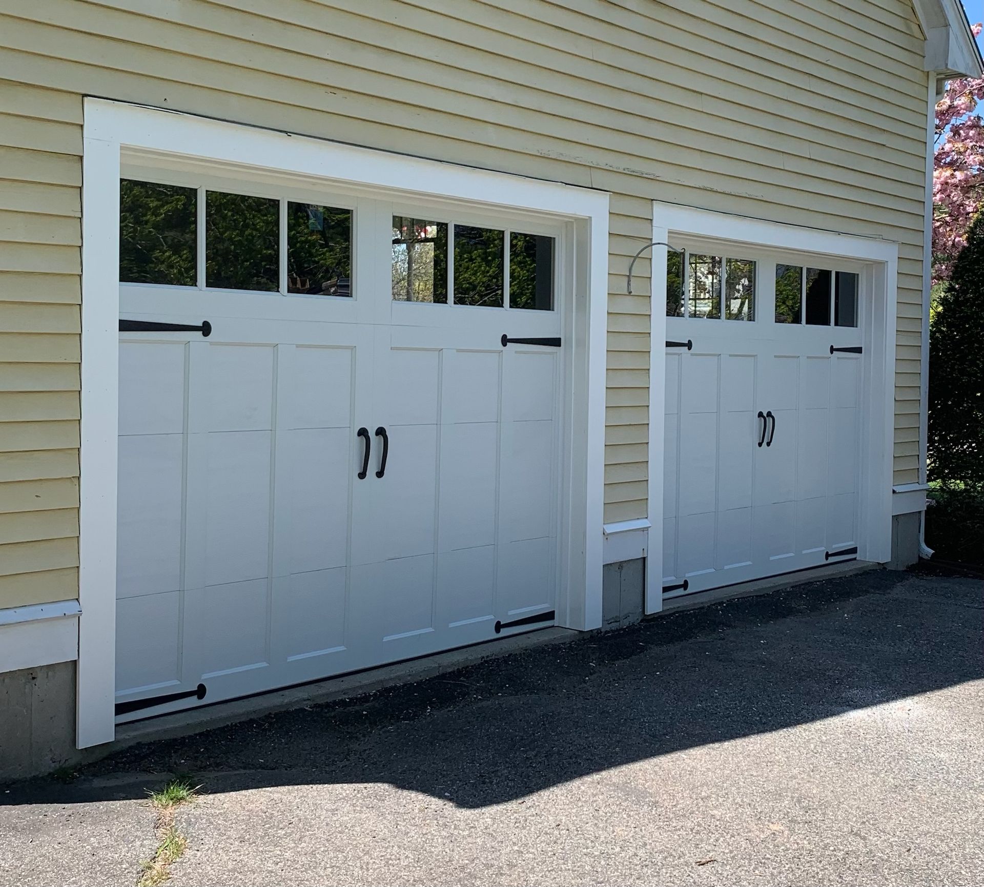 Two white garage doors with the number 22 on them