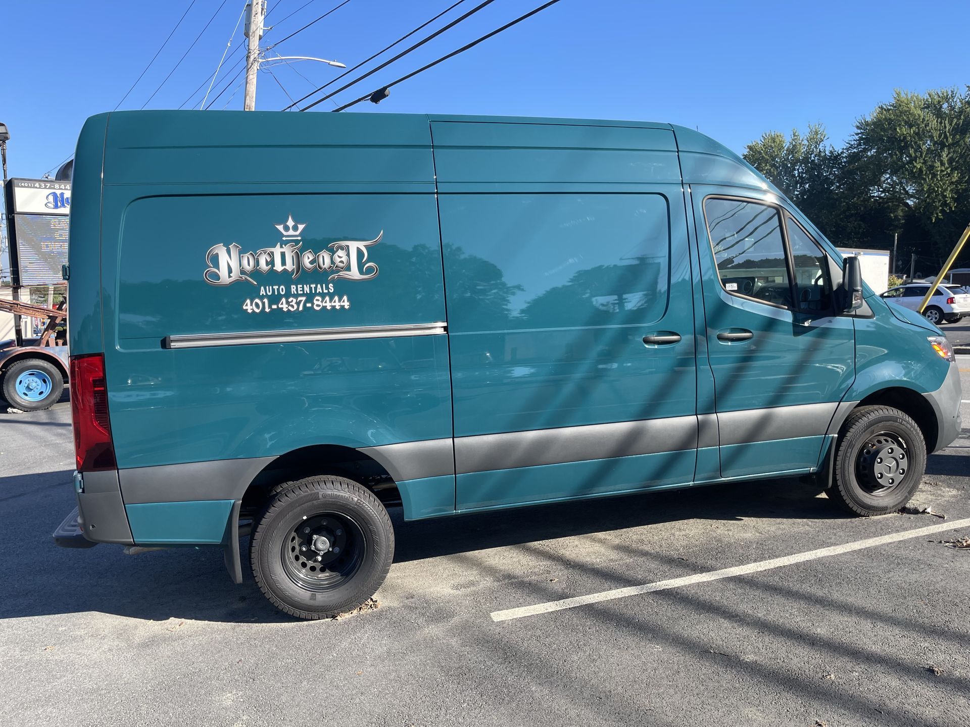 A van is parked in a parking lot.