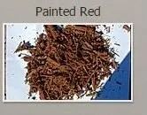 Pile of red-painted wood chips.