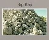 Pile of light-colored rip rap, likely for erosion control.