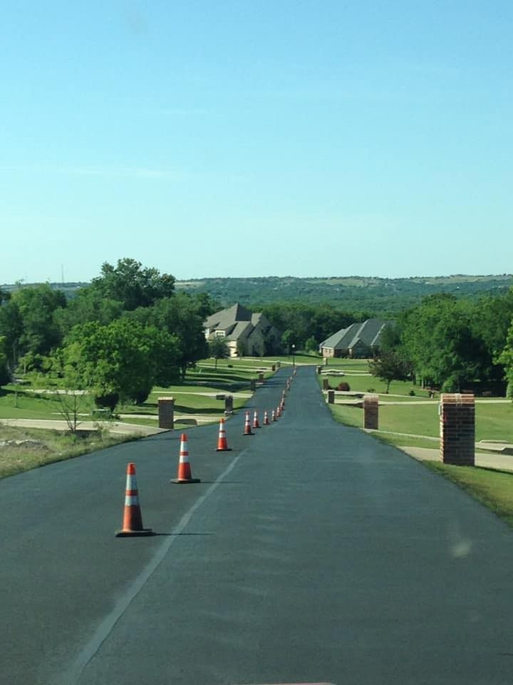 A road with a lot of traffic cones on it